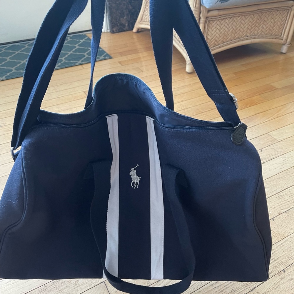 Unisex Polo weekend bag or carry on! Never used ! Blue color with white stripes!